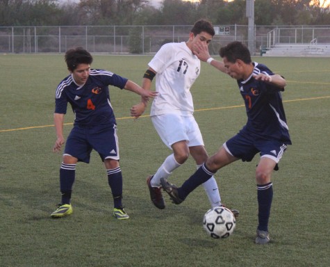 Senior Jonathan Hinojosa tries to keep the ball and move forward a game against Chatsworth.  Photo from 