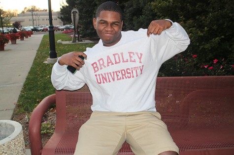 Photo courtesy of  Abigail Hanneman  Patrick Avongnon Jr., former Peal Post editor shows off his Bradley University sweatshirt.
