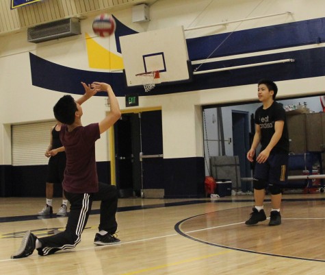 Sophomore Jonas Acebes sets to sophomore Jon Dumindin on a one-on-one drill at Birmingham’s main gym to prepare for their season that started March 25.  The Patriots have an overall record of 3-4 for the season.