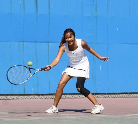 Senior Elyssa Gorospe returns the tennis during a match at BCCHS' tennis courts.