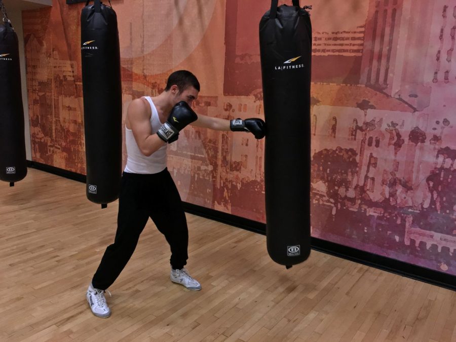 Senior Gera Pimenov practices his punches at his local LA fitness gym. Pimenov has been boxing for since March.