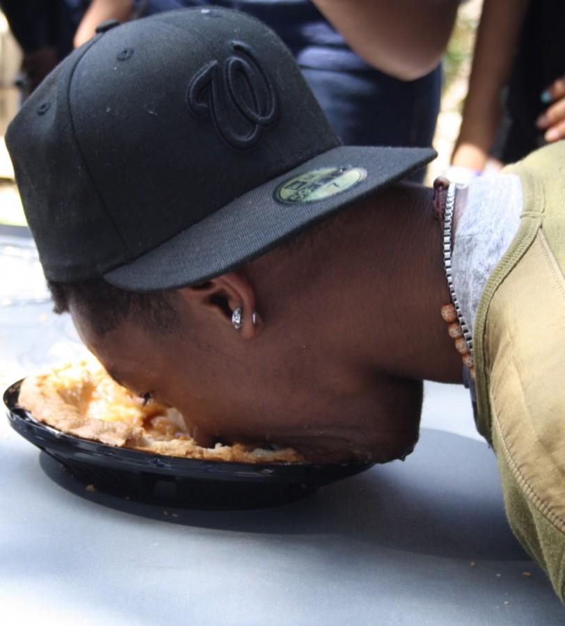 Senior Chance Wilson competes in Daniel Pearl Magnet High Schools pie-eating contest. Photo by Ana Perez