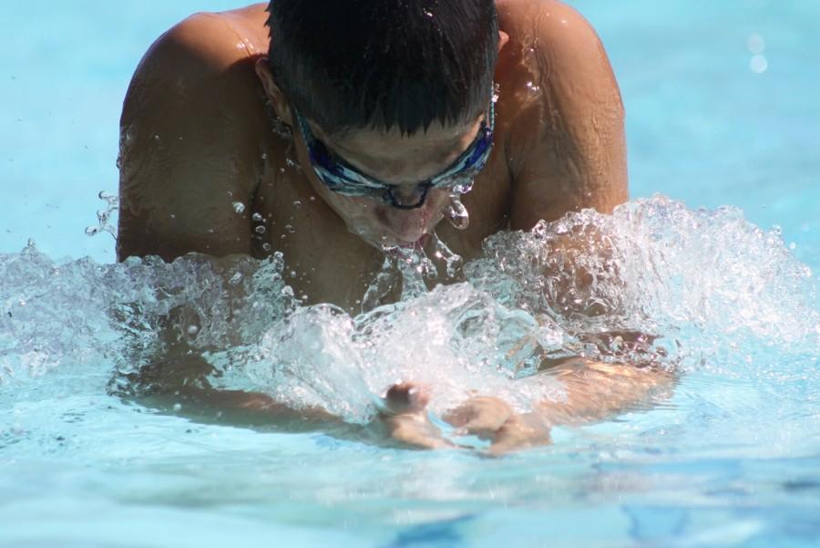 Photo by Rusel Ramirez. Varsity swimmer Maxim Grinfeld glides through the water during a strenuous practice. Grinfeld has been involved in swim since his parents advised him to take the sport as a child.