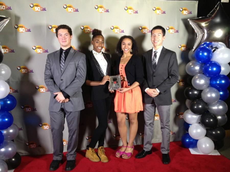 Four students (from left to right), Danny Uhlenberg, Jade Bell, Ayla Allen and Carlos Godoy take a photo on the red carpet. Photo by Adriana Chavira