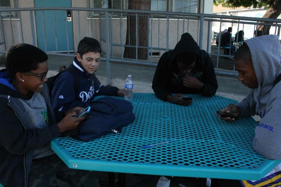 Photo by Dion Mazor
Sophomore Lorenzo Escobar spends time with his friends during nutrition.