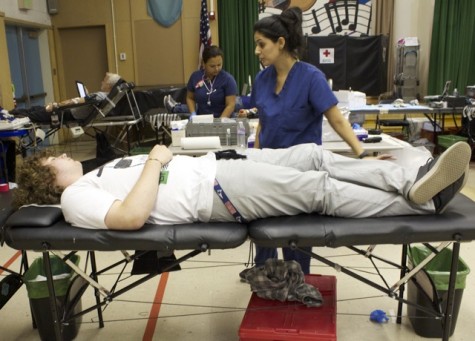 Junior Erich Haines was among the dozens of students and staff who donated blood on Oct. 3 as a part of the blood drive that was hosted by the America Red Cross. Leadership students organized the event. Photo by Veronica Godoy