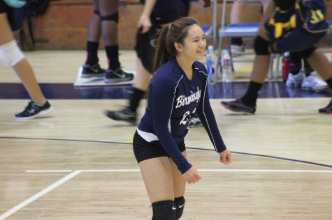 Varsity player Erica Mallari smiles as she warm ups before the home game versus Granada Hills Charter that was played Sept. 30 which they lost by a score of 0-3.  Photo by Jordan Timsit