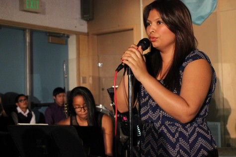 Senior Imani Brown, on guitar, performs with senior Elizabeth Ayala, their rendition of “Human” by Christina Perri. Photo by Hailey Pohevitz.