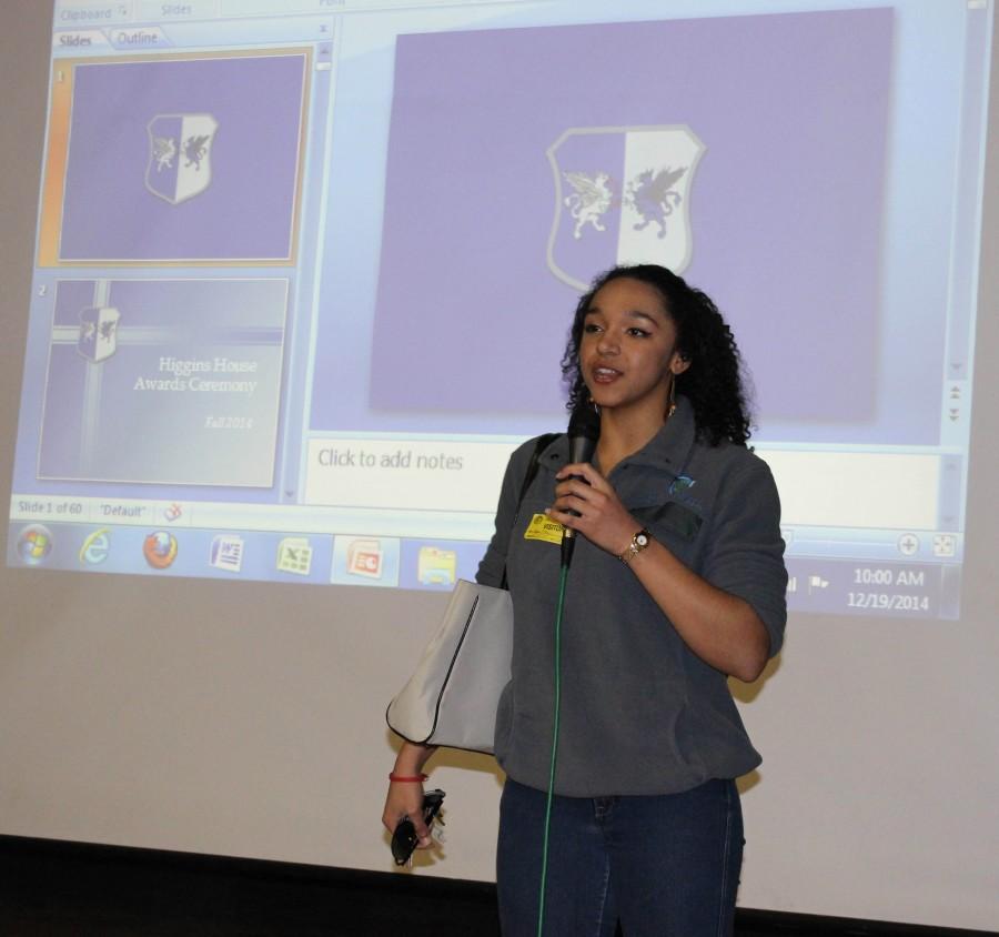 Alumna Ayla Allen gives an impromptu speech to the Higgins house. 