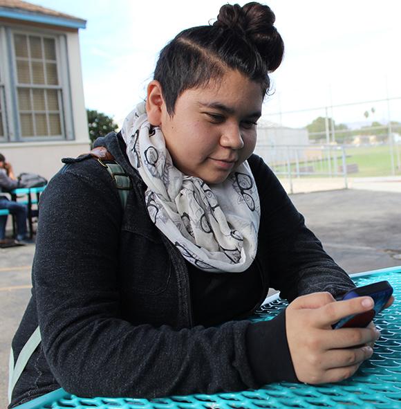 Freshman Lisset Bayardo uses her phone to show that she failed her Life Unplugged project. Life Unplugged is a project conducted in Journalism 1 classes in which students go 24 hours without technology.