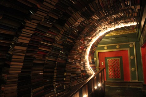 On the second floor, a hallway encompasses the guest with books which are all $1.