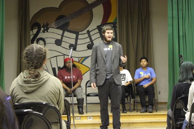 Zach Perlmuter performs one of his poems during the Get Lit assembly on Tuesday.