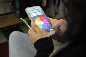 Photo by Angelo Marmol “Trivia Crack” has become an addicting quiz game among teens. Junior Ileana Roca spins the question wheel while playing “Trivia Crack.”