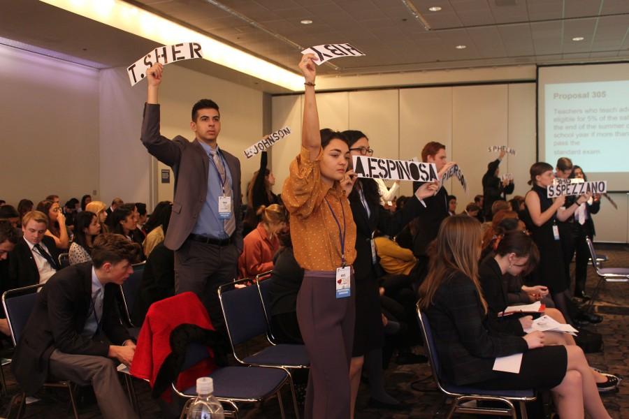 Students vote for their chosen delegate as a part of the mock Sacramento experience at the youth government program.