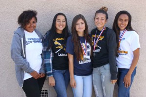  Tahra Hunter, Andrea Escamilla, Brianna Lopez, Ana Perez and April Serrano wear their medals for their superb victory in the lacrosse city championship finals.