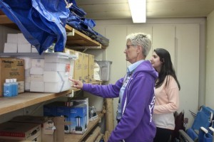 Principal Deb Smith shows junior Rita Chidbachian the school’s supplies that can be used during emergencies. Photo by Monica Hernandez 