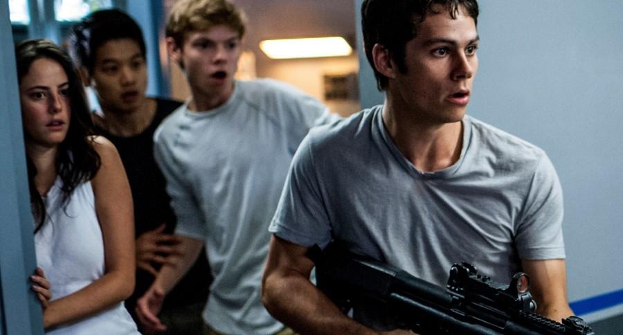 Photo of Teresa (Kaya Scodelario), Minho (Ki Hong Lee), Newt (Thomas Brodie-Sangster) and Thomas (Dylan O’Brien) fighting their way through the Scorch. 
