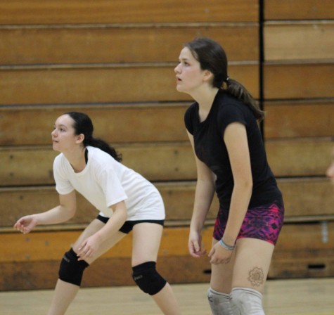 Juniors Savannah Orrill and Lissa Favela get in position, waiting for the ball. 