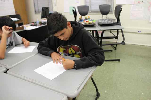 Freshmen Isaac Negrete and Benjamin Sanchez compete in a math contest during lunch.  
