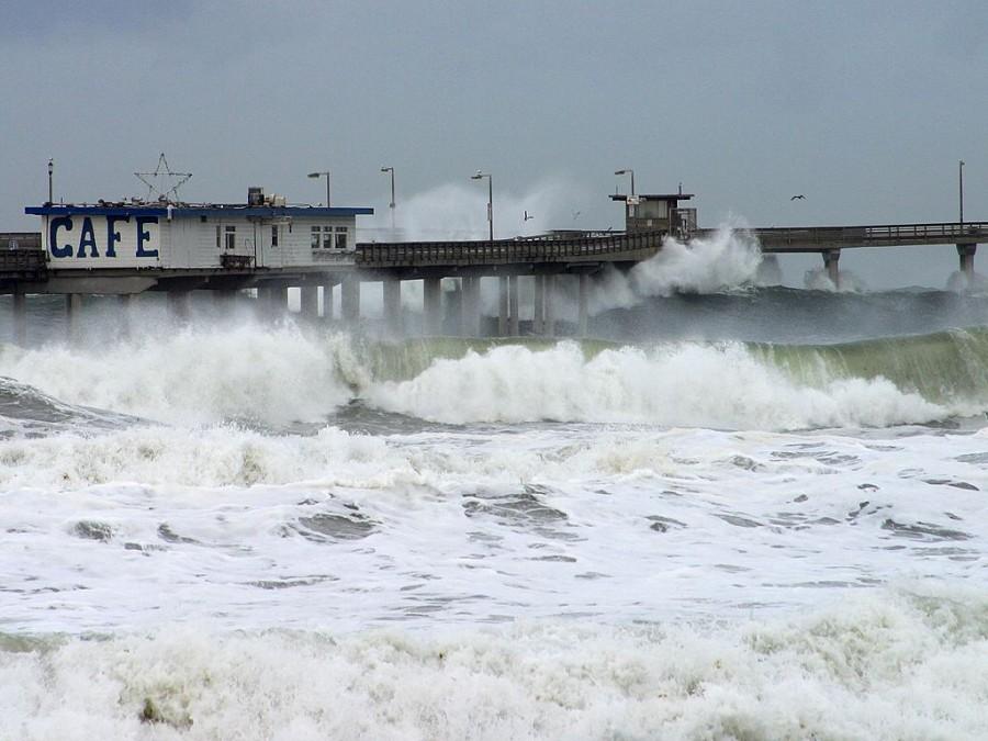 A storm causes massive waves to crash into a dock. Storms are expected when El Niño arrives in Southern California early next year.