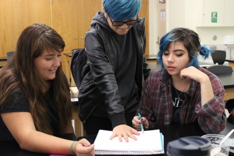 Officers Kamyrn Blake, Kyle Marin and Jo Cortes plan how to educate the student body about LGBTQ