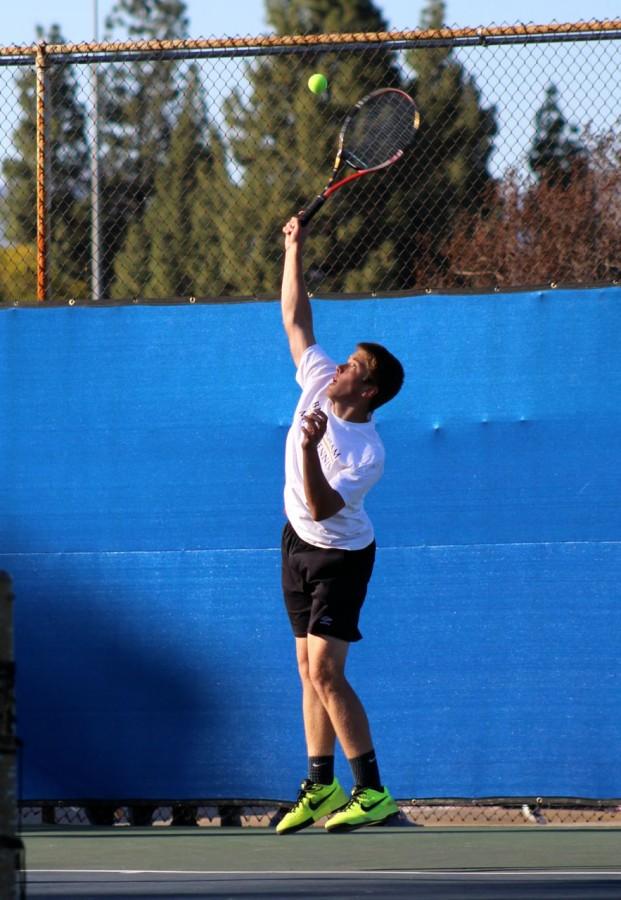 Junior Jozsef Feher prepares to hit the ball. He plays on th varsity tennis team and pactices almost every day.