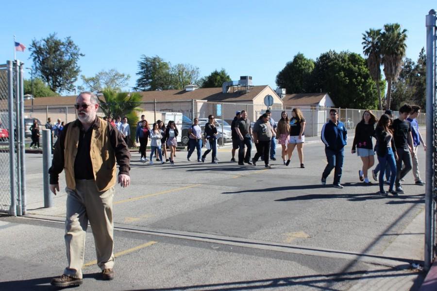 Students walk to the performance What Goes Around at Birmingham Community Charter High School.