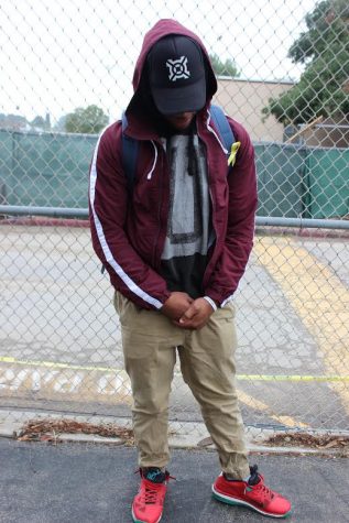 Senior Eric Flowers wears a hat with a logo, which makes it inappropriate for school. 