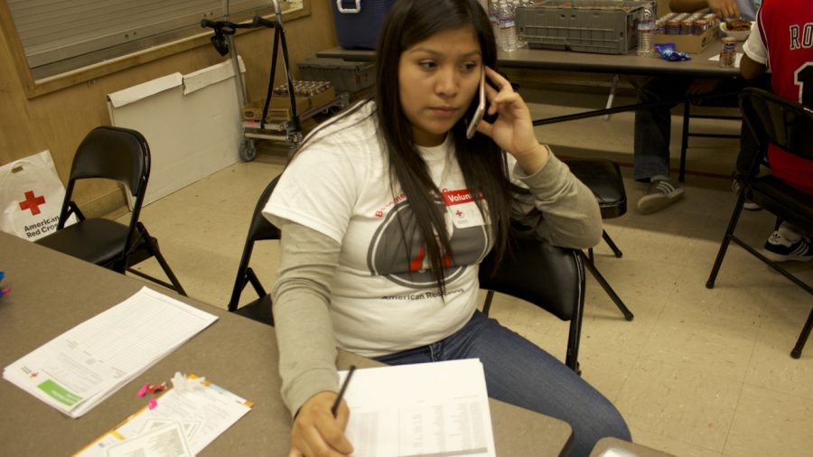 Senior Nely Correa volunteers at the blood drive by collecting names of the students donating. Photos by Anne Lima.