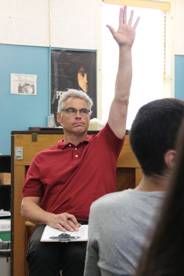 Music teacher Wes Hambright takes roll for new piano class.