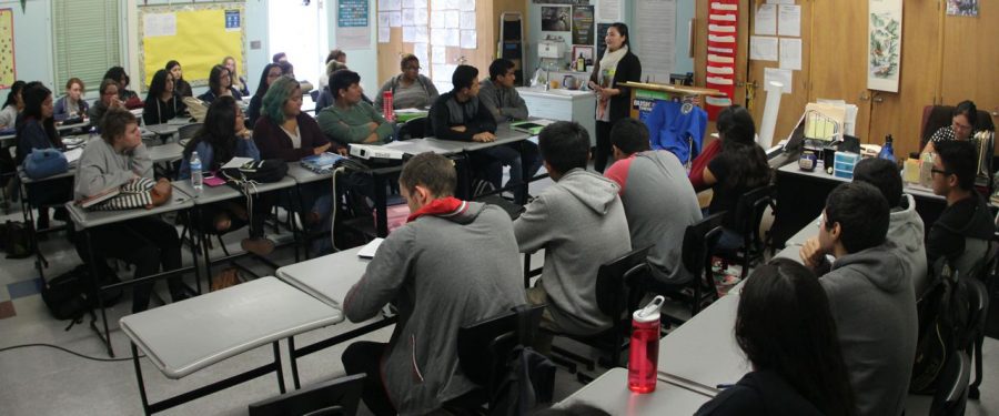 A former student talks to history teacher Davy Mauermann’s first period AP Government class of 33 students about college applications.