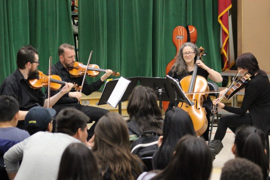 The Kadima String Quartet engages students with their performance.