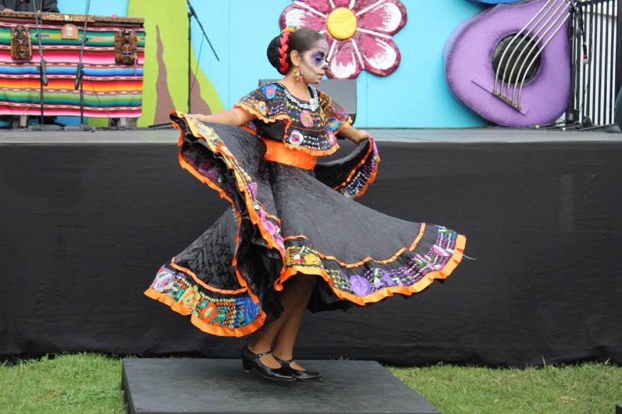 A young girl takes part in the folklorico performance.