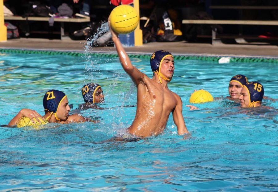 Photo by April Serrano
Sophomore Ben Sanchez shoots the ball to warm up for the game against Roosevelt High School. The Patriots lost against Granada on Nov. 7 and won’t be going to playoffs.
