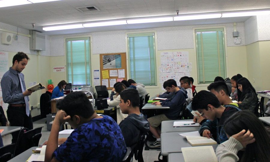 Student teacher Kyle Edwards teaches in English teacher Leah Pevar’s relocated classroom during Period 4.