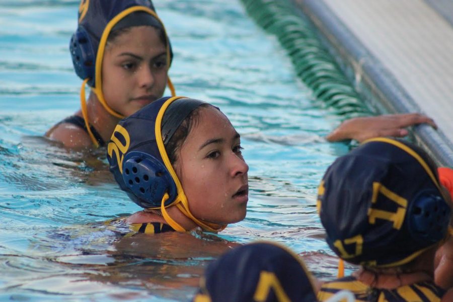 Freshman Gabriella Angos rests on the side of the pool after the Birmingham Community Charter High School vs. Culver City High School game. BCCHS’s junior varsity team lost 13-4.