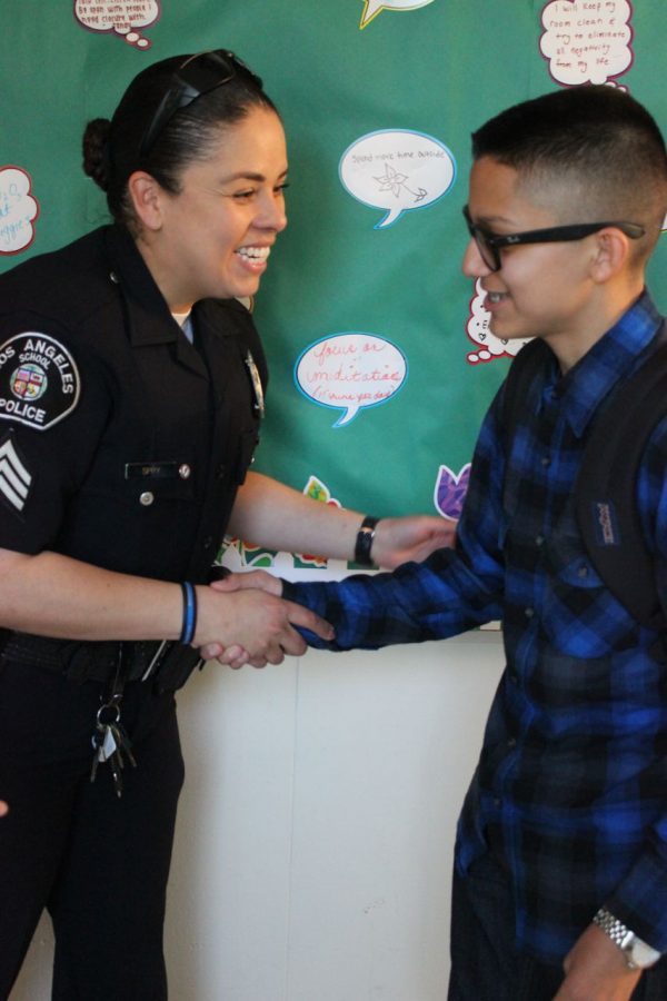 Sergeant Julie Spry from the LAUSD police department greets main actor Jason Echeveria.