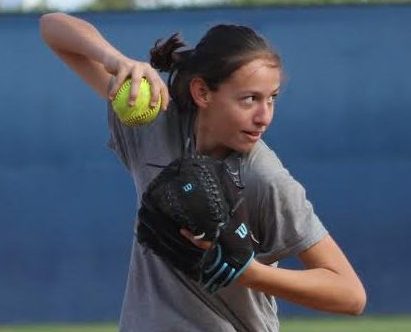 Freshman Olivia Bullock prepares to throw the softball during after school practice at Birmingham Community Charter High School.