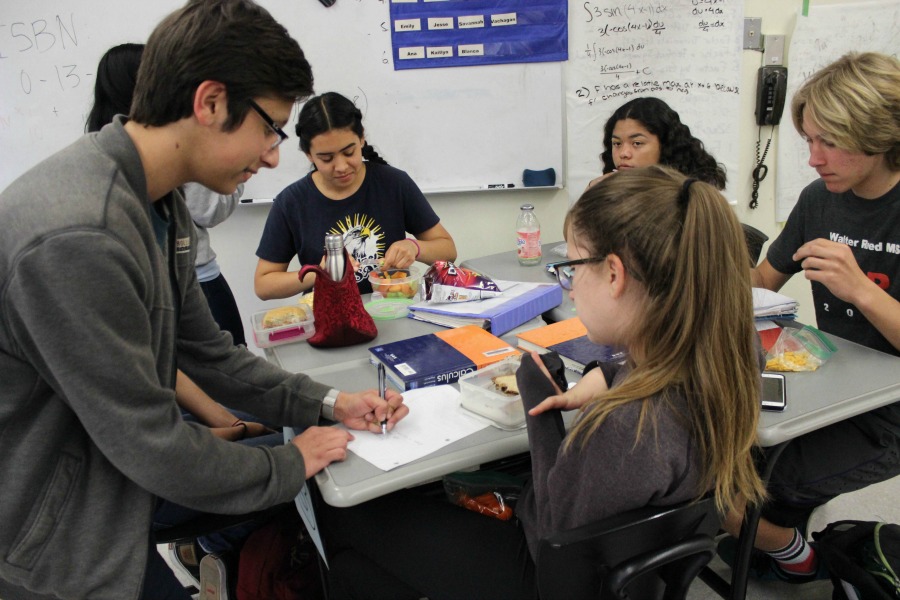 President Michael Chidbachian and Vice-President Karina Mara introduce the topic of the week, ISBN numbers to club members Julissa Rangel, Lauryn Uhlenberg, Kirsten Cintigo and Culyer Huffman.