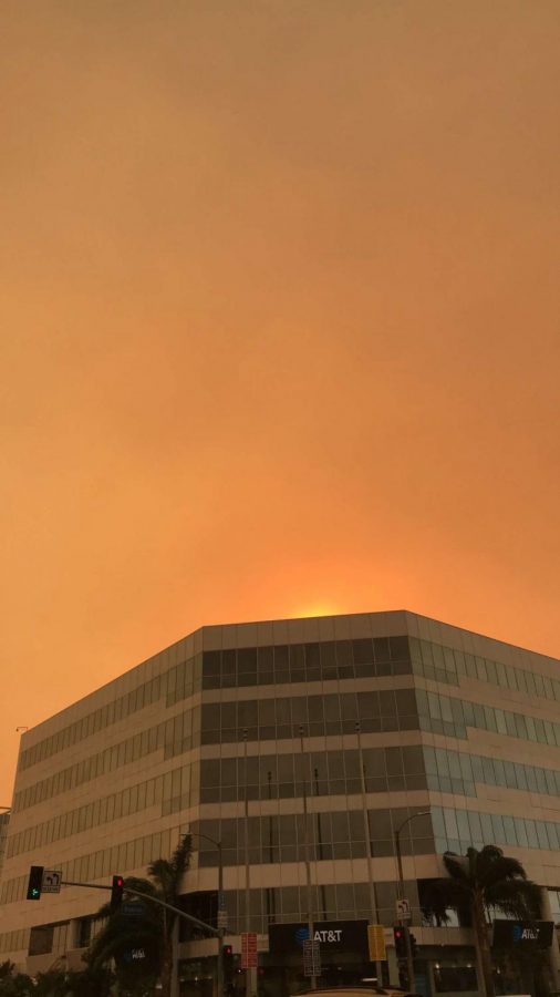 Powerful wind brought the smoke from surrounding wildfires to the valley, resulting in unhealthy and dangerous air quality. The sky at the intersection of Roscoe and Van Nuys boulevards is orange from wildfires in December 2017.