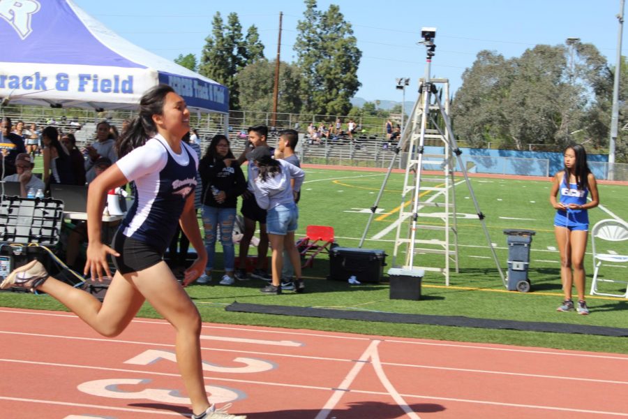 Sophomore Keona Paniagua approaches the finish line during a track meet at Birmingham Community Charter High School.