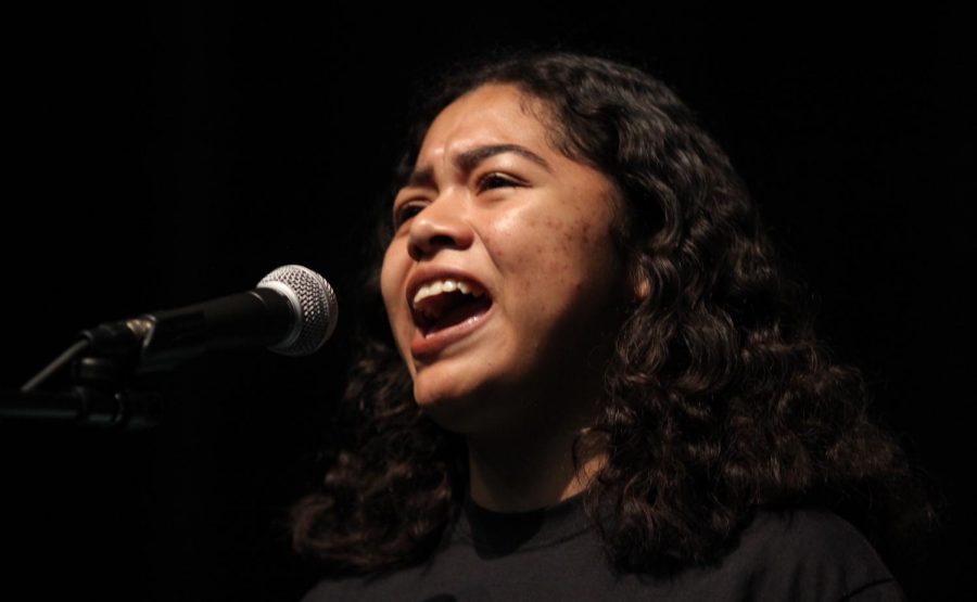Junior Kirsten Cintigo performs her response poem, A Suppressed Tale at the Get Lit Classic Slam on April 26.