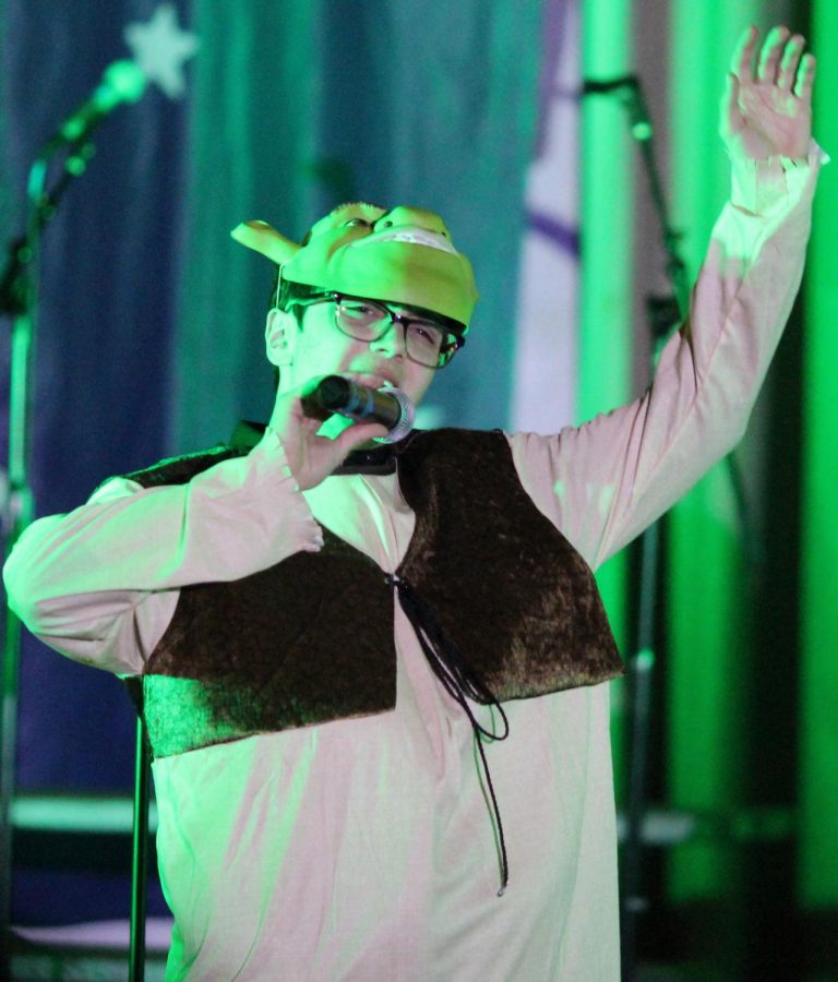 Sophomore Logan Townsend performs All Star while dressed up as Shrek during the Starry Night Performance on May 3. 