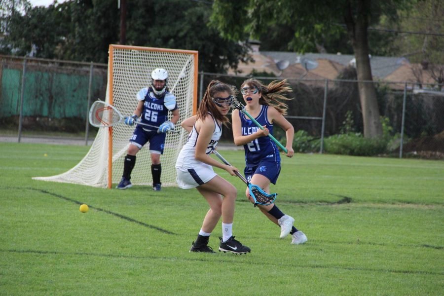 Junior varsity Karen Ticas looks behind as the ball passes by during the match against Crescenta Valley High School. Birmingham Community Charter High School’s girls junior varsity lacrosse team lost against the Falcons 4-5.