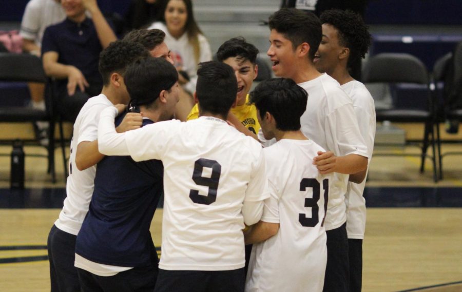 Birmingham Community Charter High Schools boys volleyball team gathers before their match against Grover Cleveland Charter High School on
April 30. The Patriots lost against the Cavaliers 0-3 in a home match.