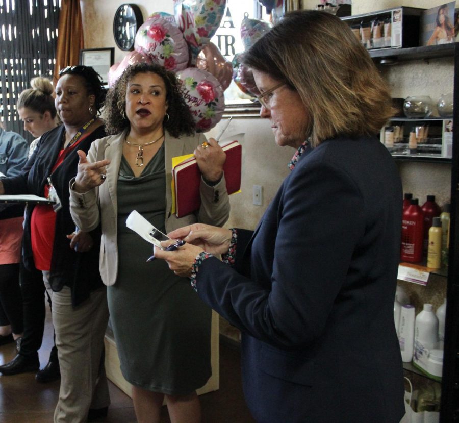 Birmingham Community Charter High School’s People Service and Attendance Counselor Maya Holden and the Pupil Service and Attendance Coordinator Dionne Ash listen to Neighborhood School Safety Prosecutor Jacquelyn Lawson suggests solutions to resolve the illegal activity including drug dealing and truancy at the plaza on the northeast corner of Balboa and Victory boulevards. 
