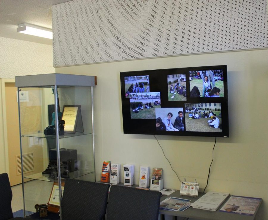 The new television is mounted on the right above the waiting area in the main office.