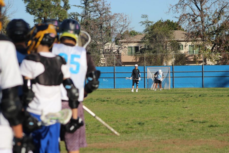 Senior Alberto Serrano prepares to defend against his teammates during a practice at Birmingham Community Charter High School.