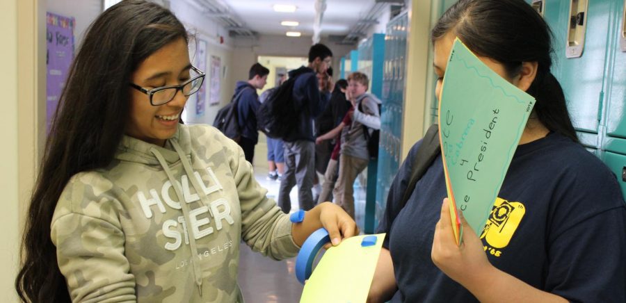 Juniors Astrid Cabrera and Mariana Sifuentes put up posters to campaign for student body positions for the upcoming 2018-2019 school year. 