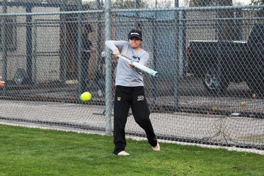 Sophomore Nattaly Villaseñor practices bunting during practice in the softball field.